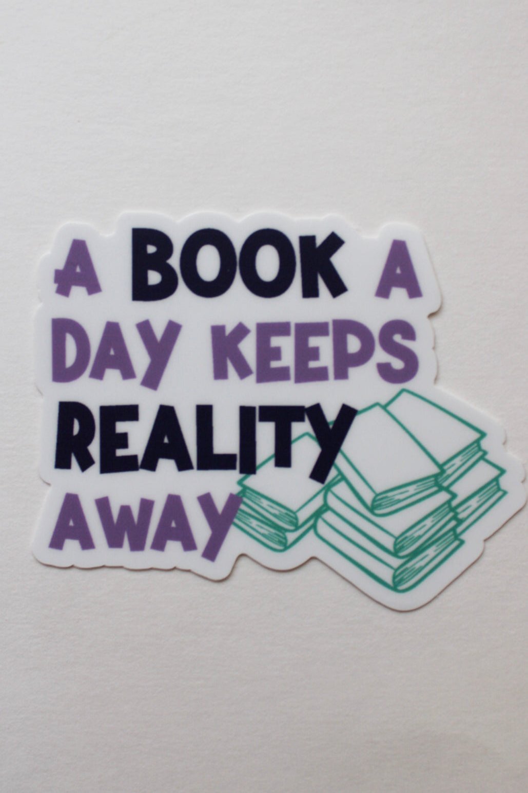 A Book a Day Keeps Reality Away - Sticker