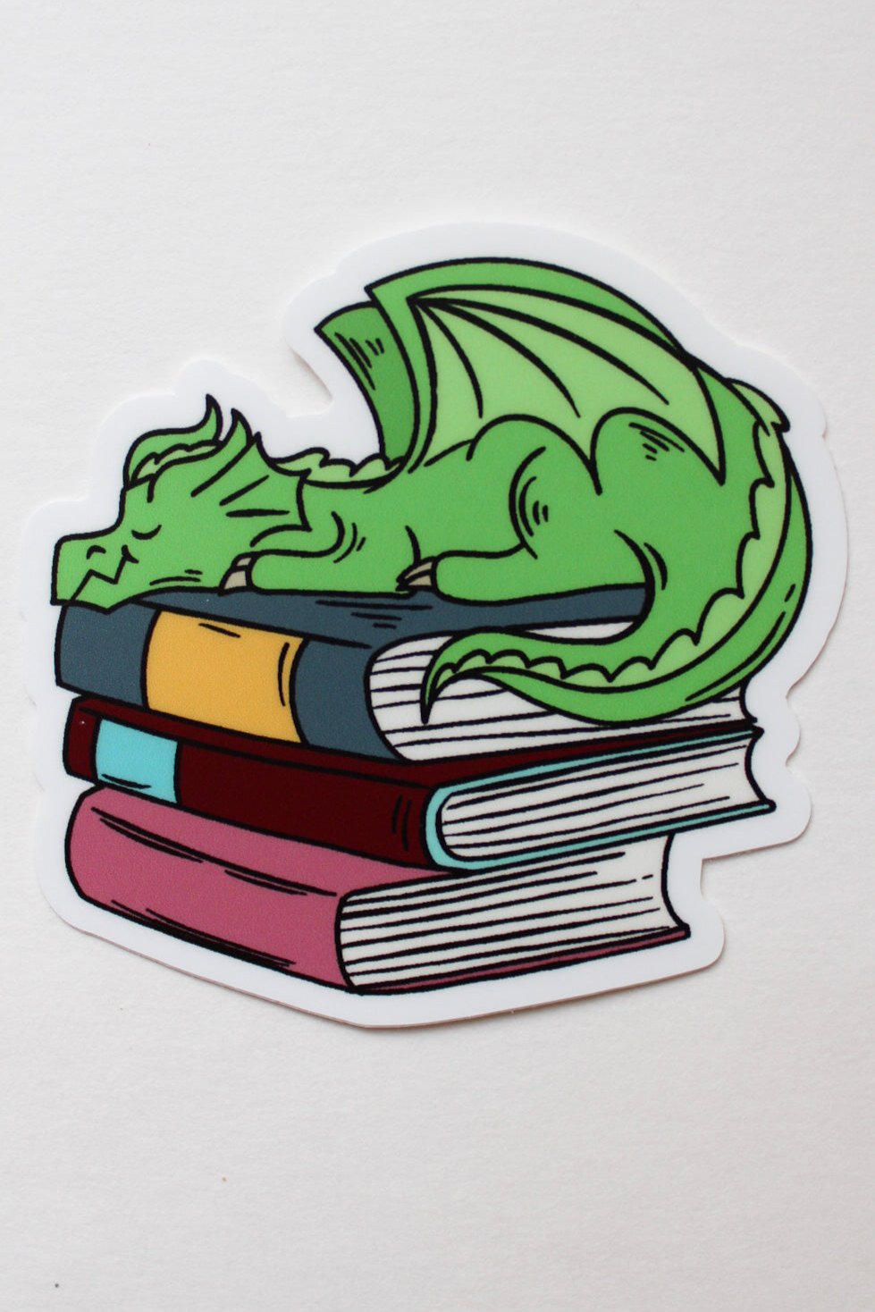 Dragon Sleeping on Book Pile - Sticker